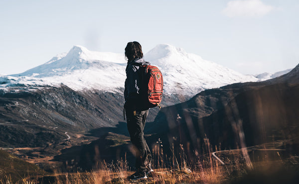 A person hiking with the Guide's Edition Synapse 25.